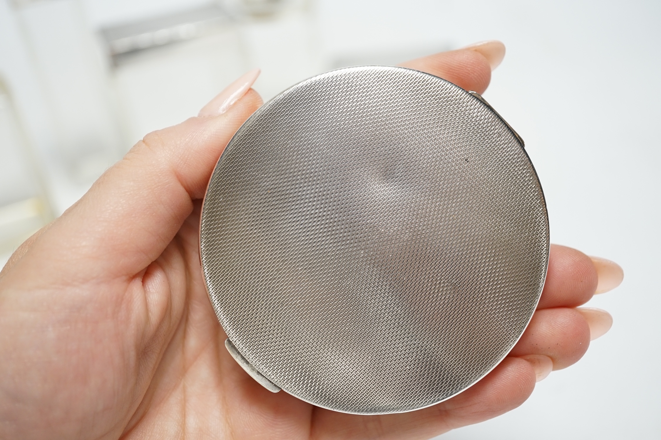 Five assorted silver topped glass toilet jars, a silver compact and an Edwardian engraved silver card case, Birmingham, 1902, 83mm.